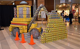 Drinking cans organized artistically to appear like construction equipment