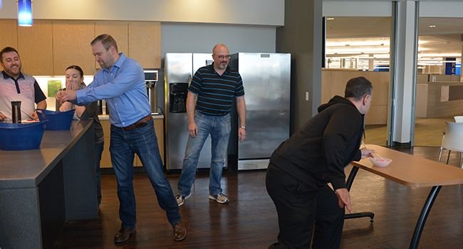 Candid photo of employees in the middle of an office competition